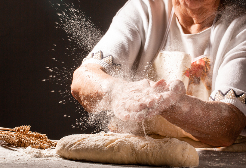 woman in apron baking bread